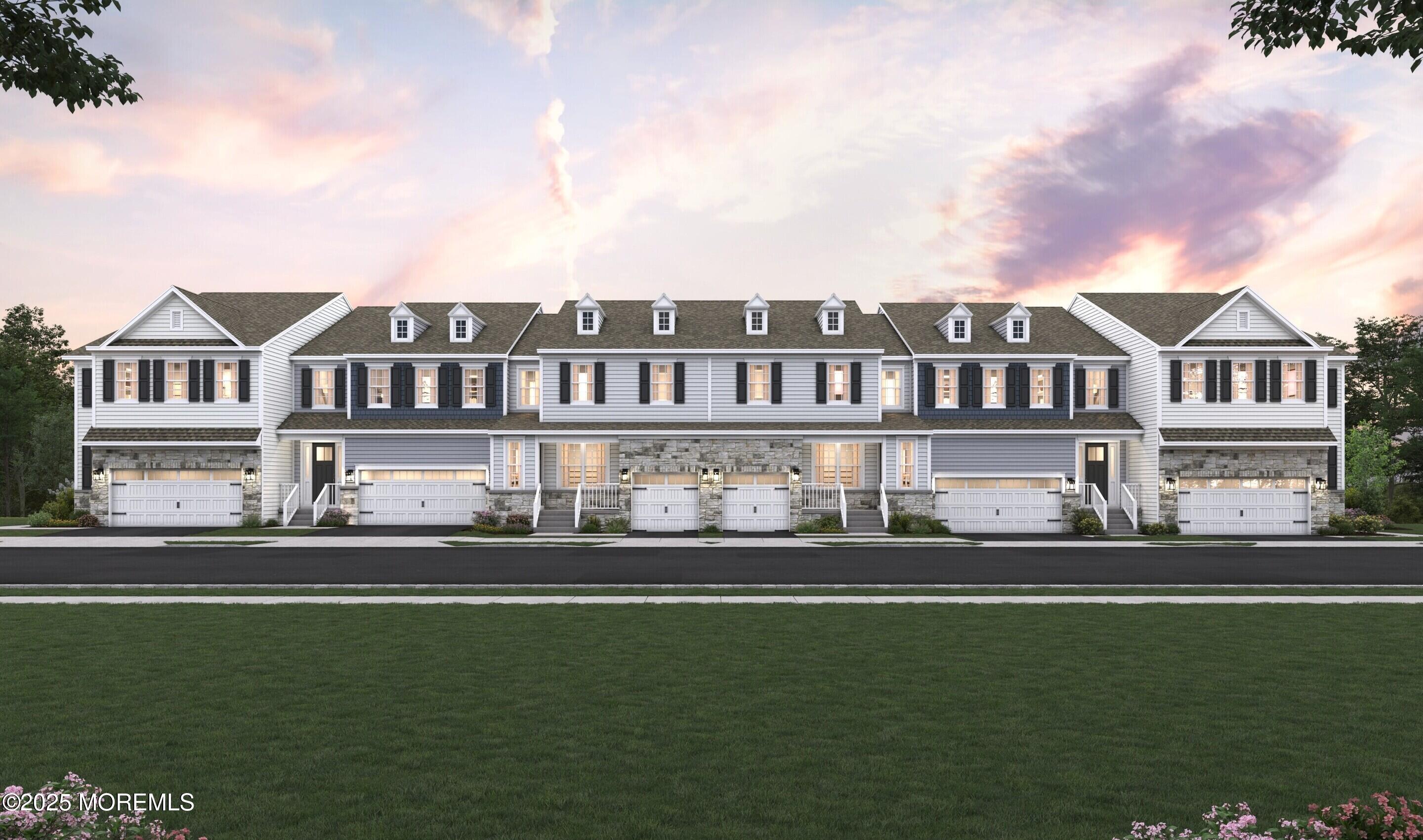 2014 Wander Lane, Unit 2004 Manalapan, NJ 07726 - Photo 21 of 21 a front view of a house with a garden and lake view