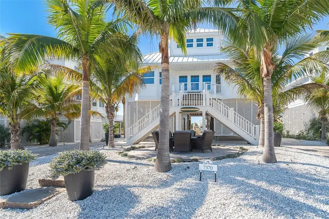 a view of a patio with a table and chairs