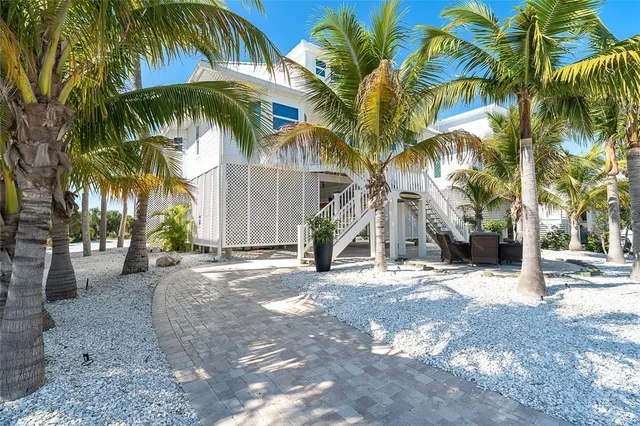a dining room with furniture a rug and wooden floor