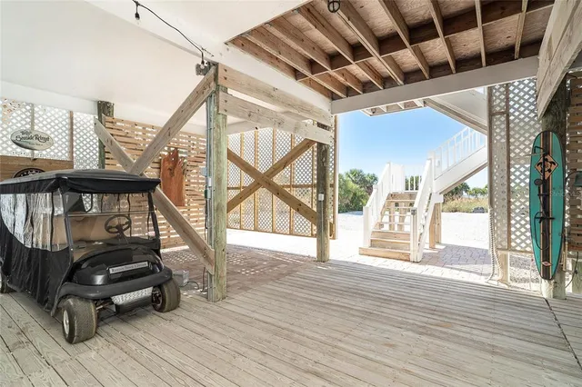 a view of a lake with lawn chairs
