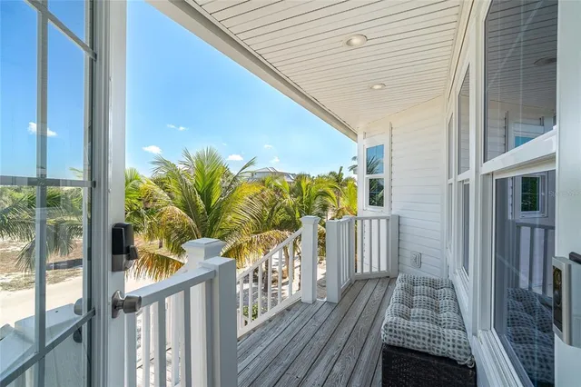 a kitchen with granite countertop a stove a sink and a refrigerator