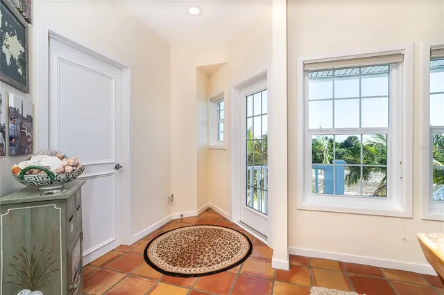 a kitchen with a sink a washer and dryer next to a window
