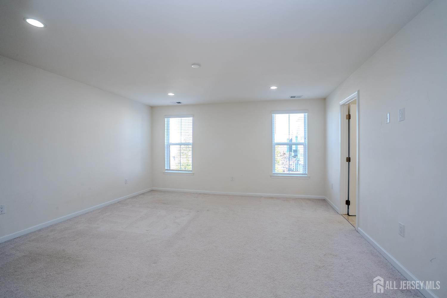 16 Clover Lane Monroe Township, NJ 08831 - Photo 15 of 36 an empty room with windows