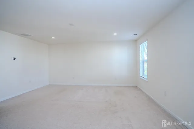 an empty room with a empty space and window