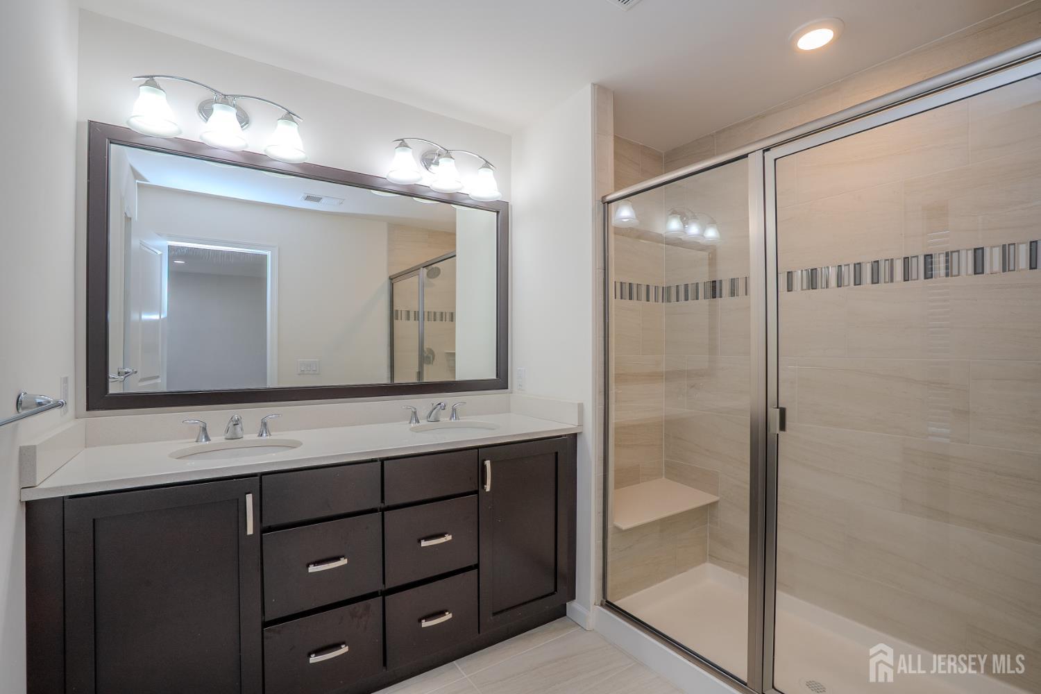 16 Clover Lane Monroe Township, NJ 08831 - Photo 18 of 36 a bathroom with a double vanity sink mirror and double