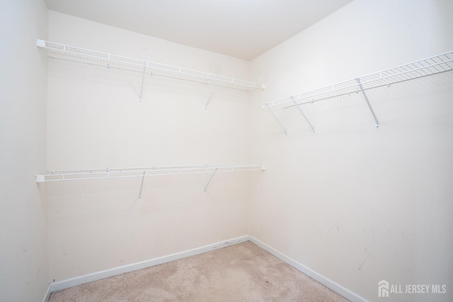 16 Clover Lane Monroe Township, NJ 08831 - Photo 20 of 36 a view of a room with racks on the wall