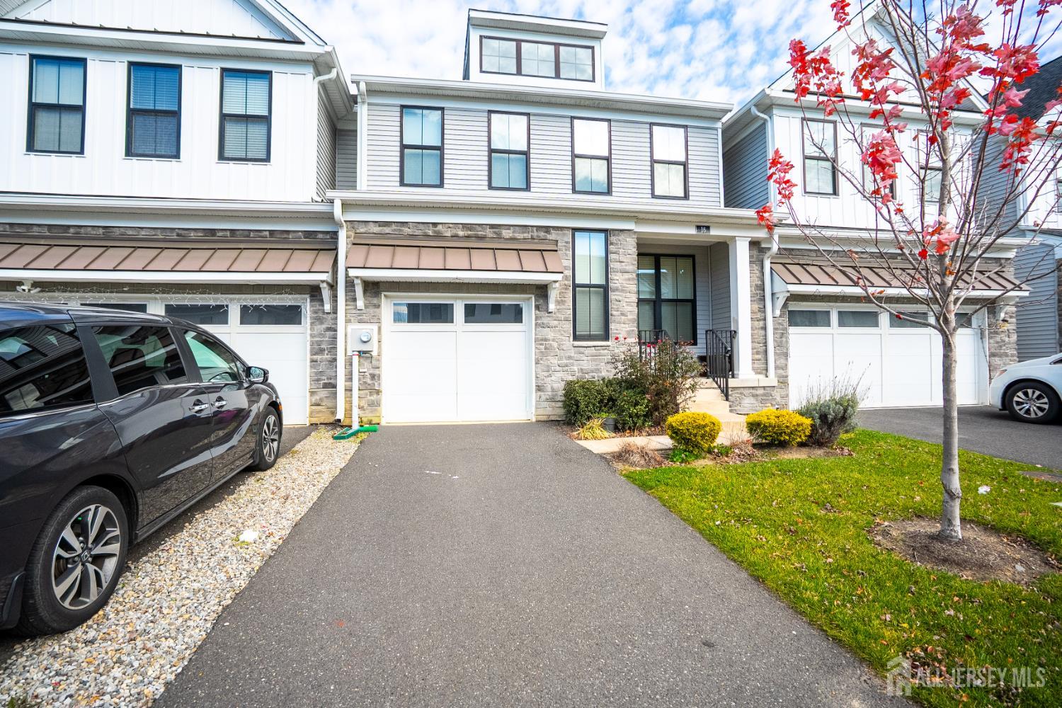 16 Clover Lane Monroe Township, NJ 08831 - Photo 2 of 36 a car parked in front of a house