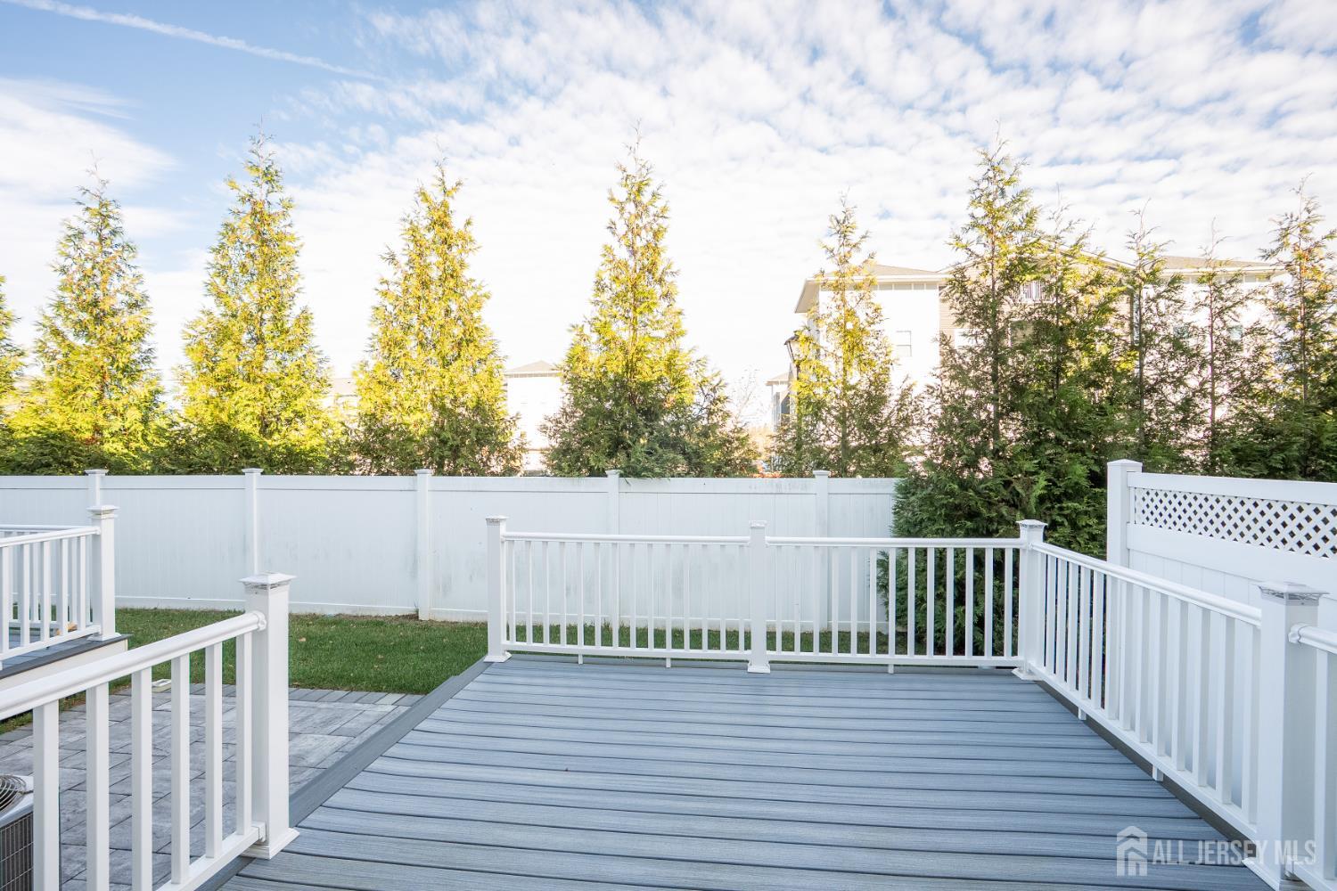 16 Clover Lane Monroe Township, NJ 08831 - Photo 34 of 36 a balcony with wooden floor and fence