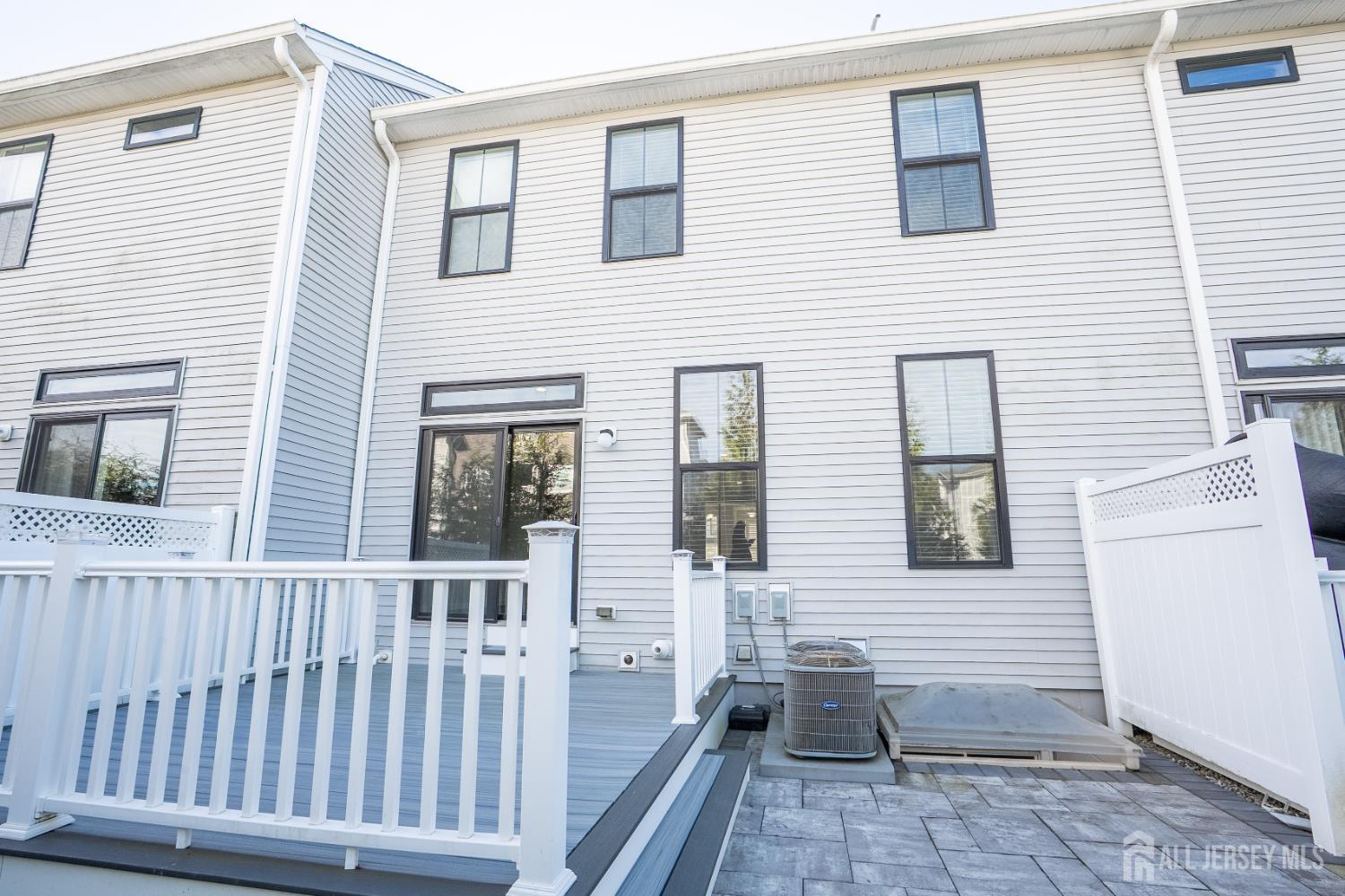 16 Clover Lane Monroe Township, NJ 08831 - Photo 36 of 36 a view of a house with wooden deck