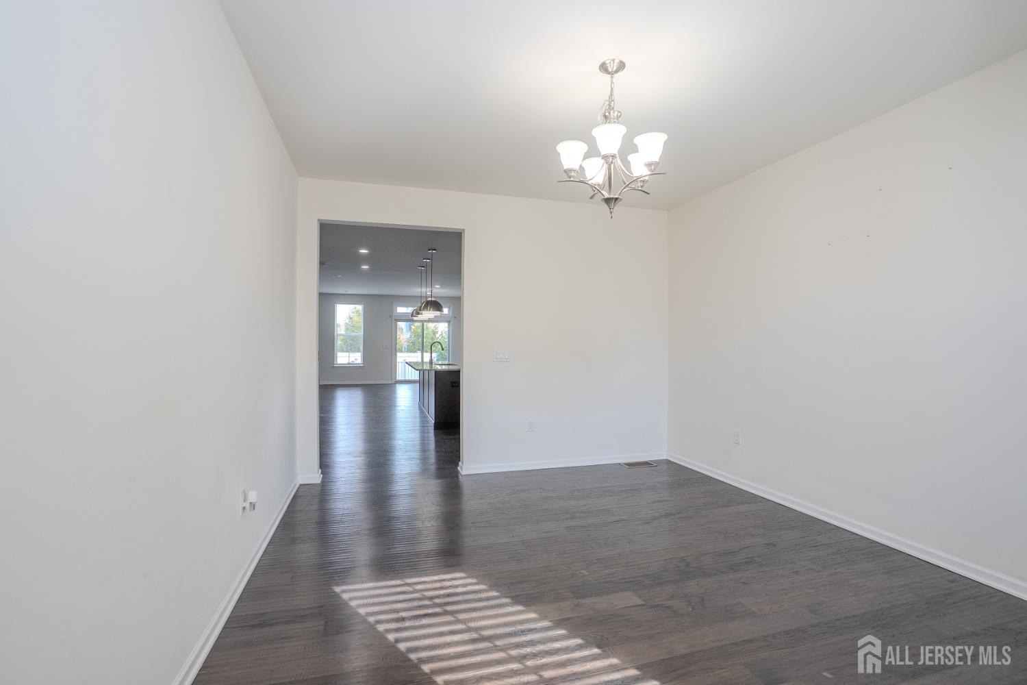 16 Clover Lane Monroe Township, NJ 08831 - Photo 4 of 36 wooden floor in an empty room