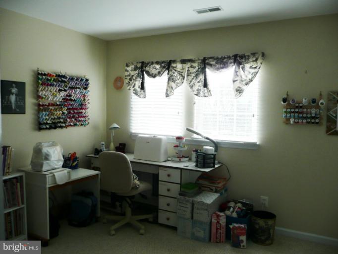42739 Middle Ridge Place Broadlands, VA 20148 - Photo 1 of 30 a room with furniture and a window