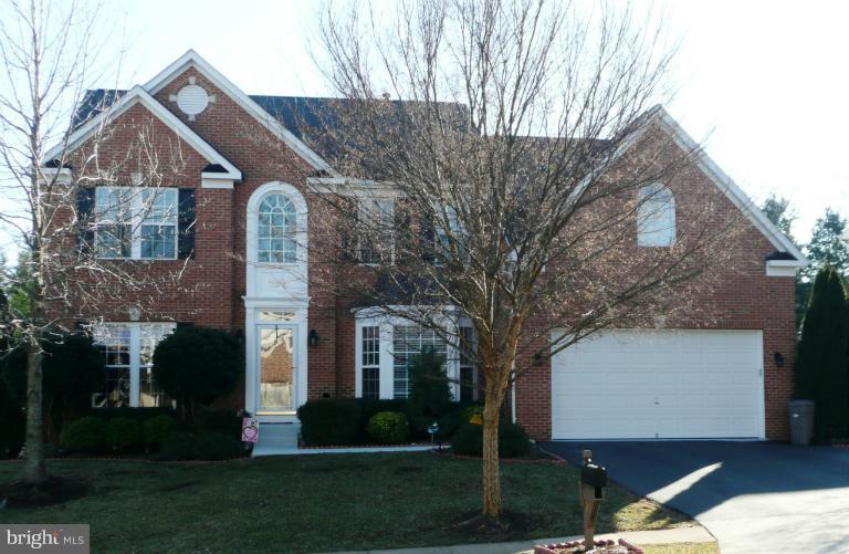 42739 Middle Ridge Place Broadlands, VA 20148 - Photo 12 of 30 a front view of a house with garden