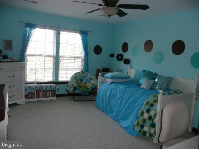 42739 Middle Ridge Place Broadlands, VA 20148 - Photo 24 of 30 a bedroom with a bed and a window