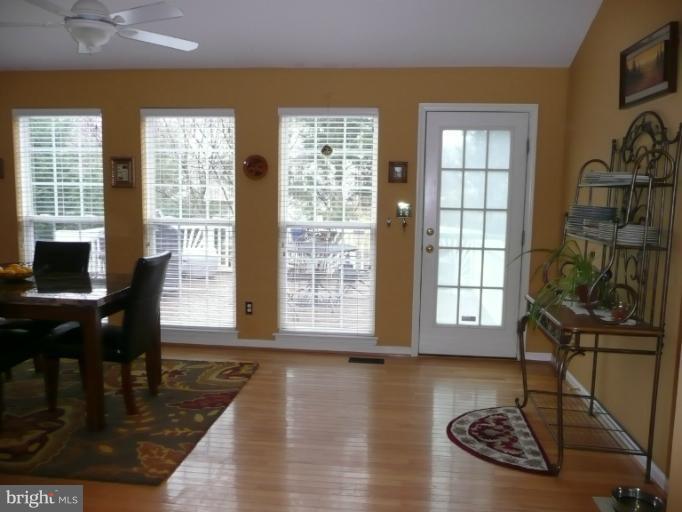 42739 Middle Ridge Place Broadlands, VA 20148 - Photo 29 of 30 a view of a livingroom with furniture window and wooden floor
