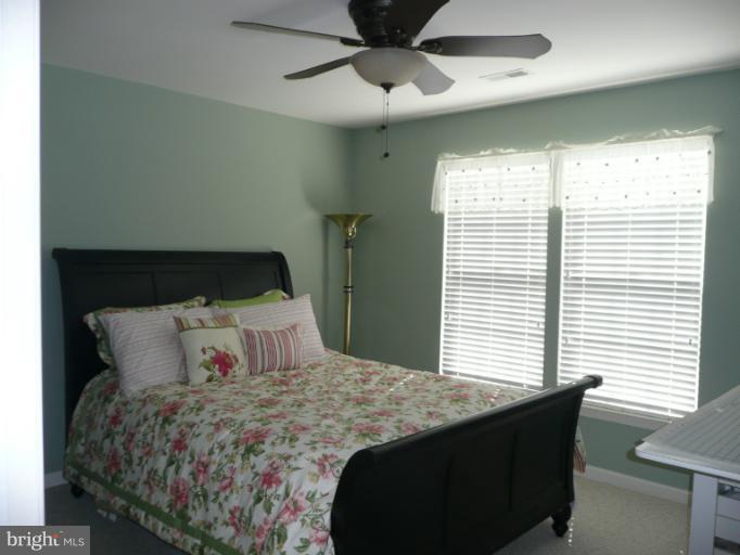 42739 Middle Ridge Place Broadlands, VA 20148 - Photo 9 of 30 a bedroom with a bed and a window