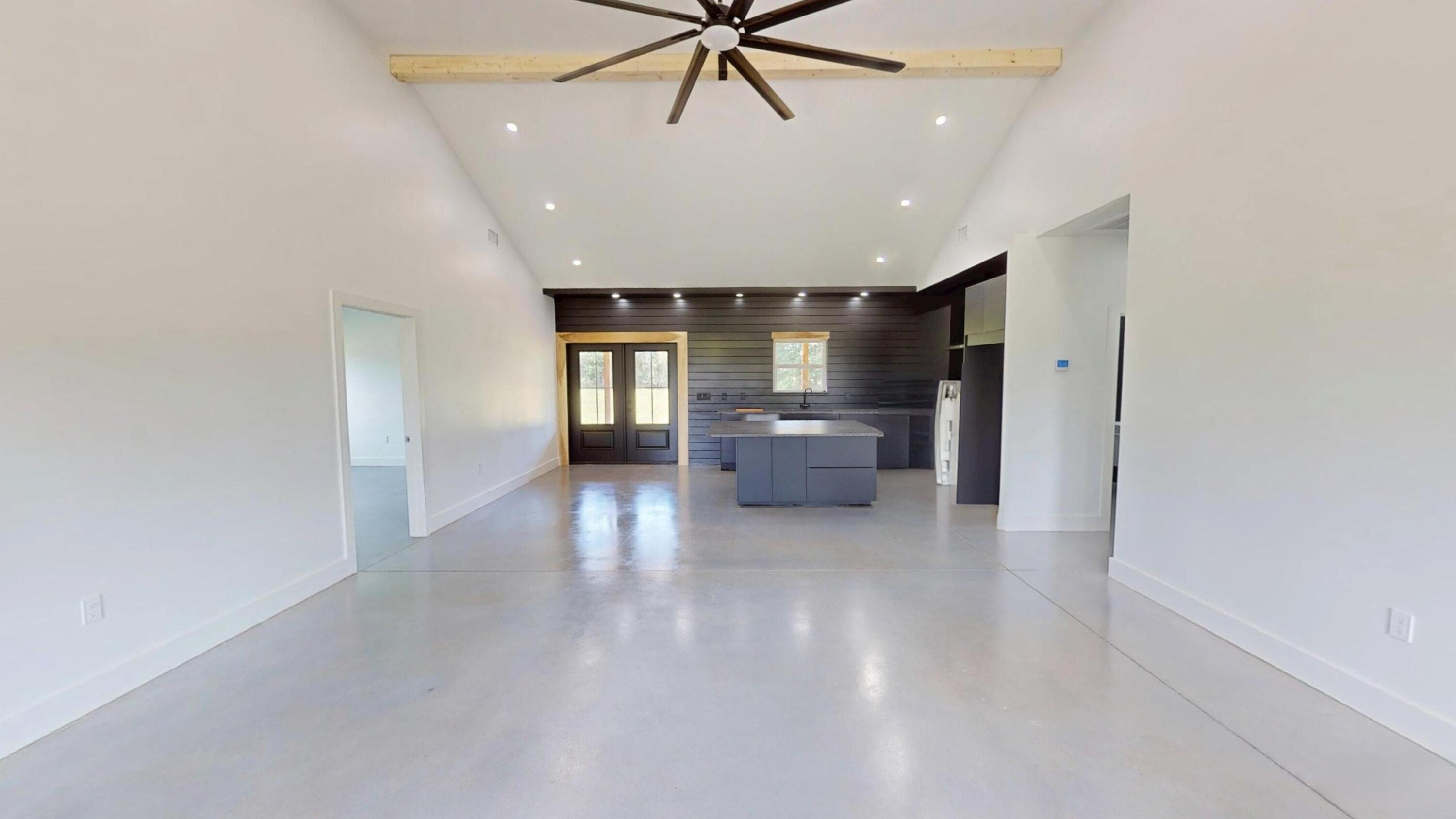 37837 Straughn School Road Out Of State, OUT OF STATE 00000 - Photo 17 of 59 a living room with furniture and kitchen view