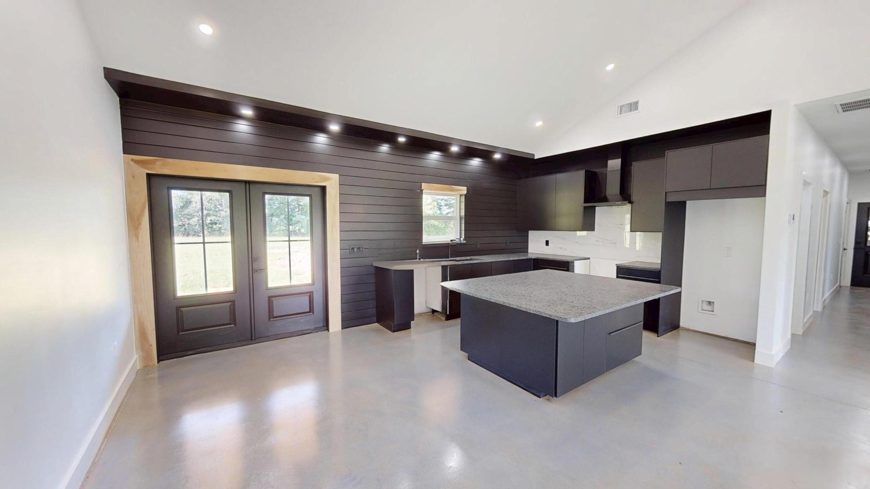 37837 Straughn School Road Out Of State, OUT OF STATE 00000 - Photo 19 of 59 a living room with stainless steel appliances kitchen island granite countertop a refrigerator and a wooden cabinets