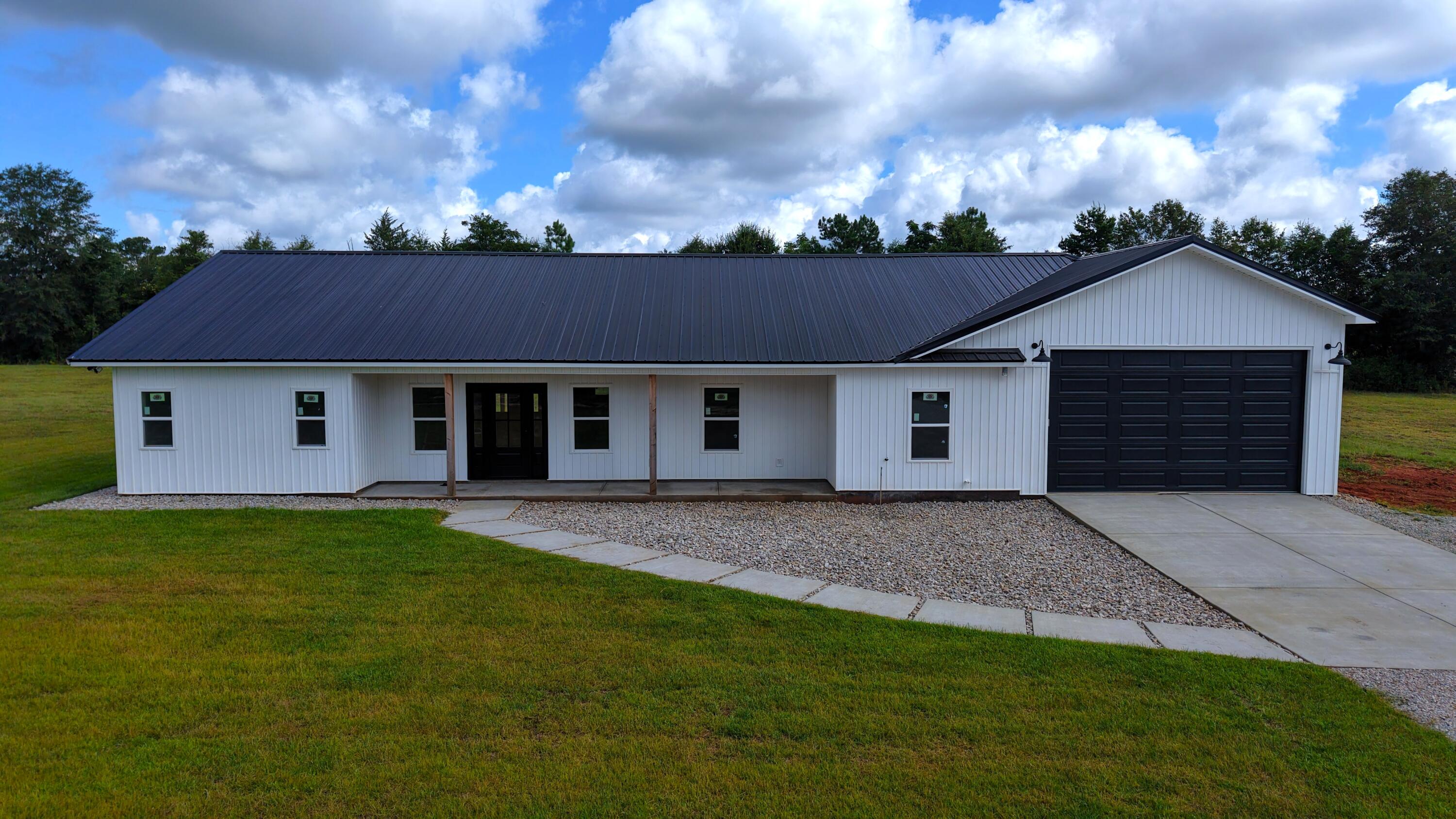 37837 Straughn School Road Out Of State, OUT OF STATE 00000 - Photo 2 of 59 front view of a house with a yard