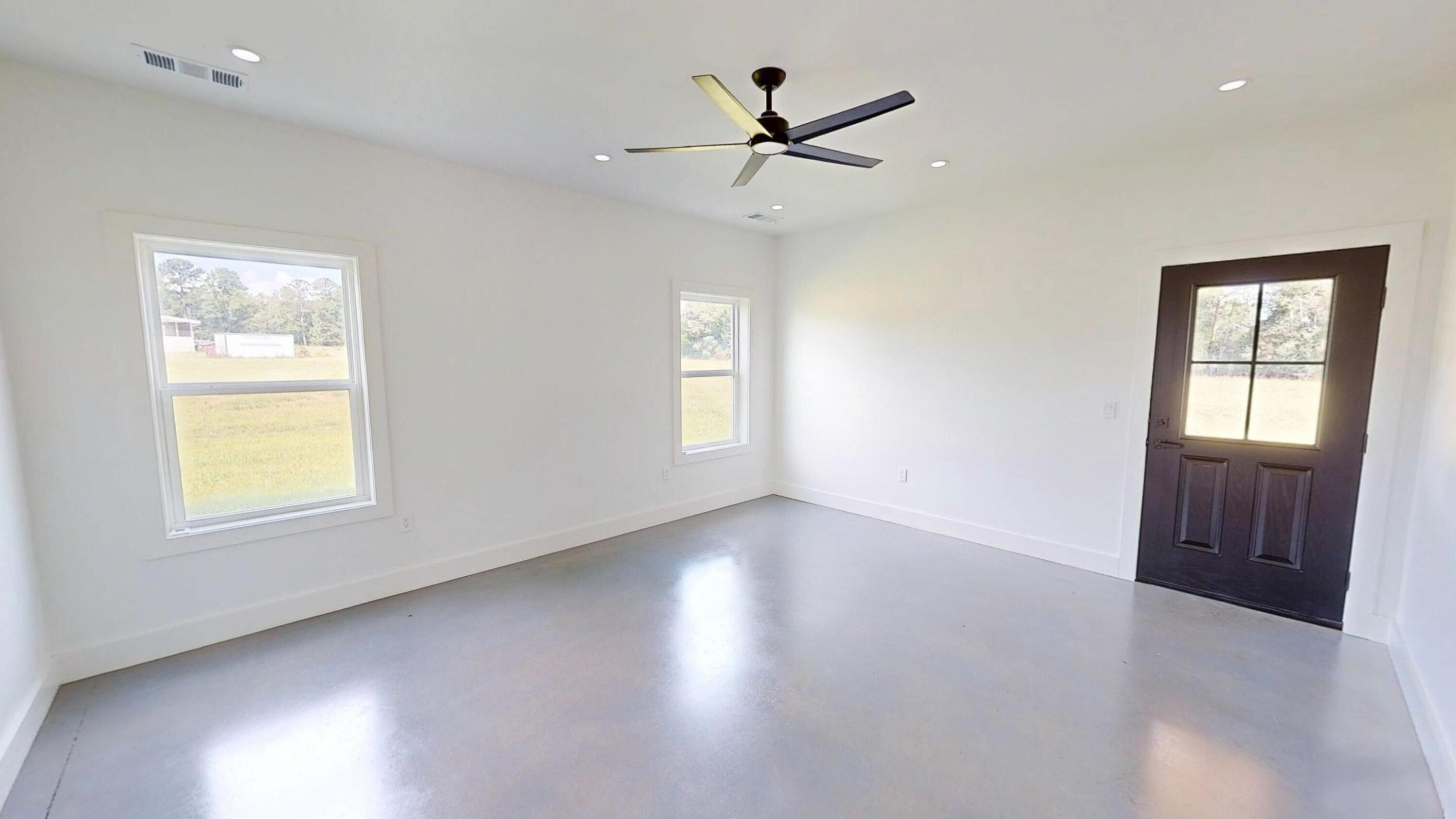 37837 Straughn School Road Out Of State, OUT OF STATE 00000 - Photo 23 of 59 a view of a livingroom with a window and wooden floor