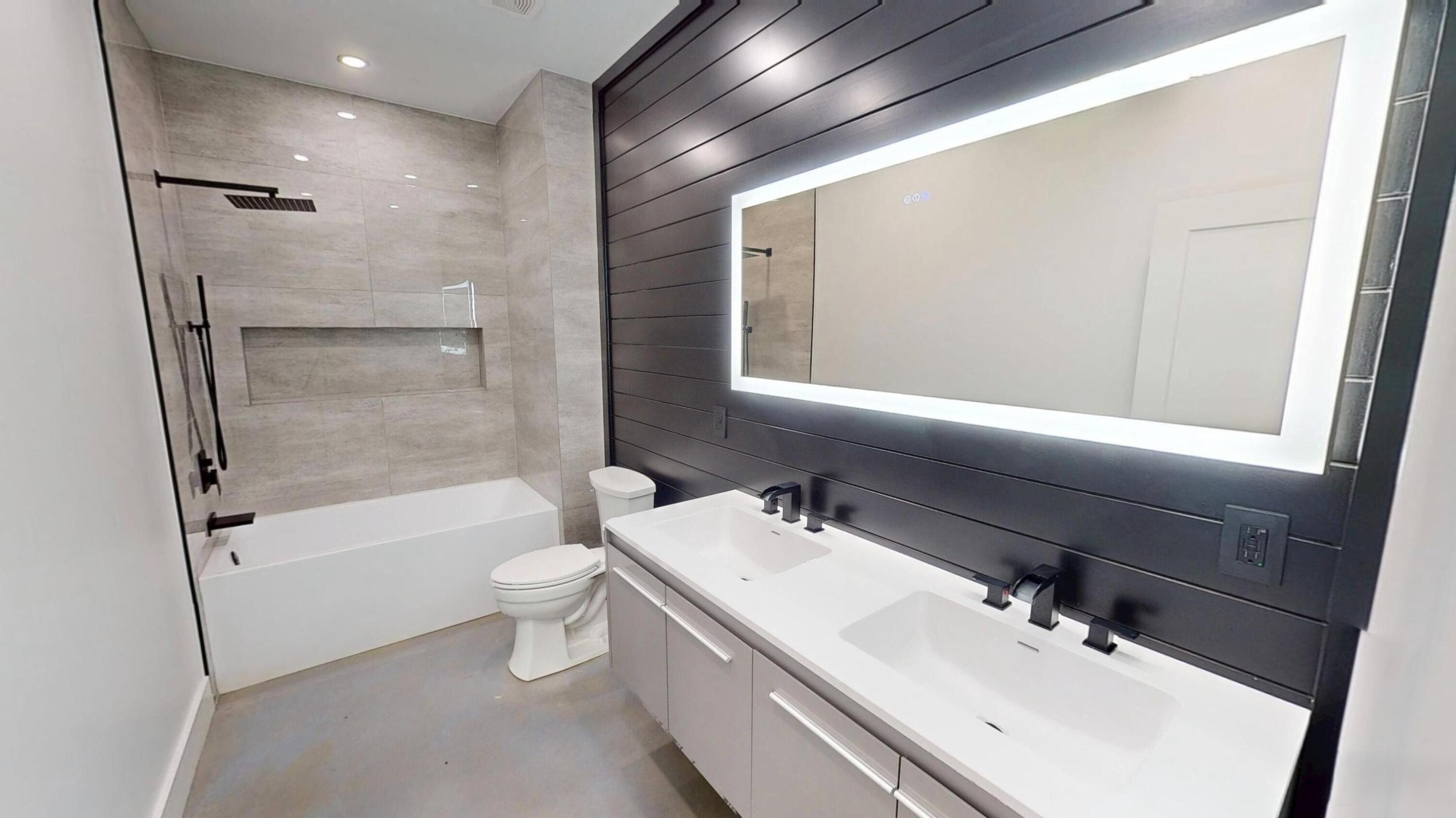 37837 Straughn School Road Out Of State, OUT OF STATE 00000 - Photo 32 of 59 a bathroom with a bathtub shower sink vanity mirror and toilet