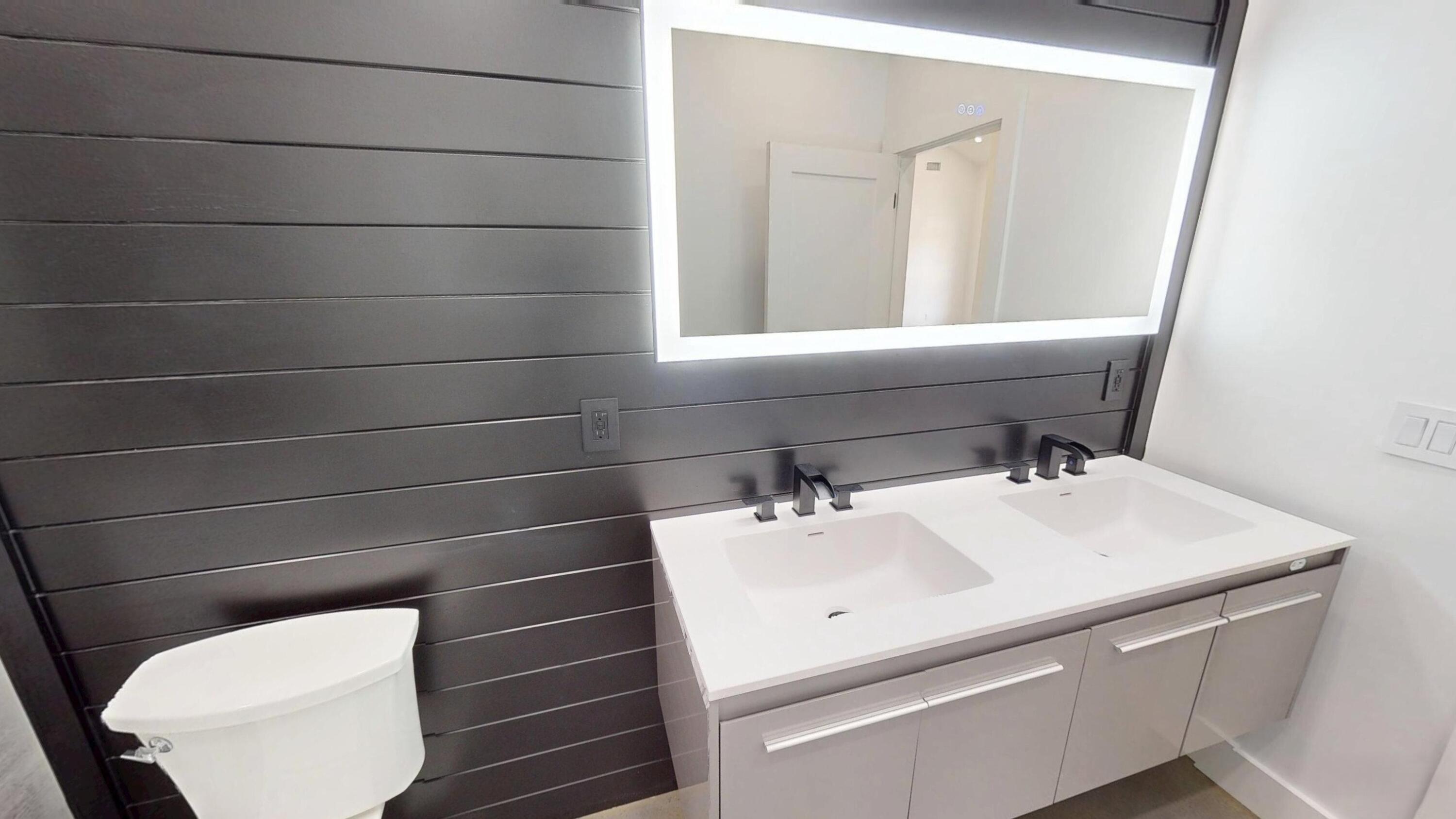 37837 Straughn School Road Out Of State, OUT OF STATE 00000 - Photo 33 of 59 a bathroom with a sink toilet and mirror