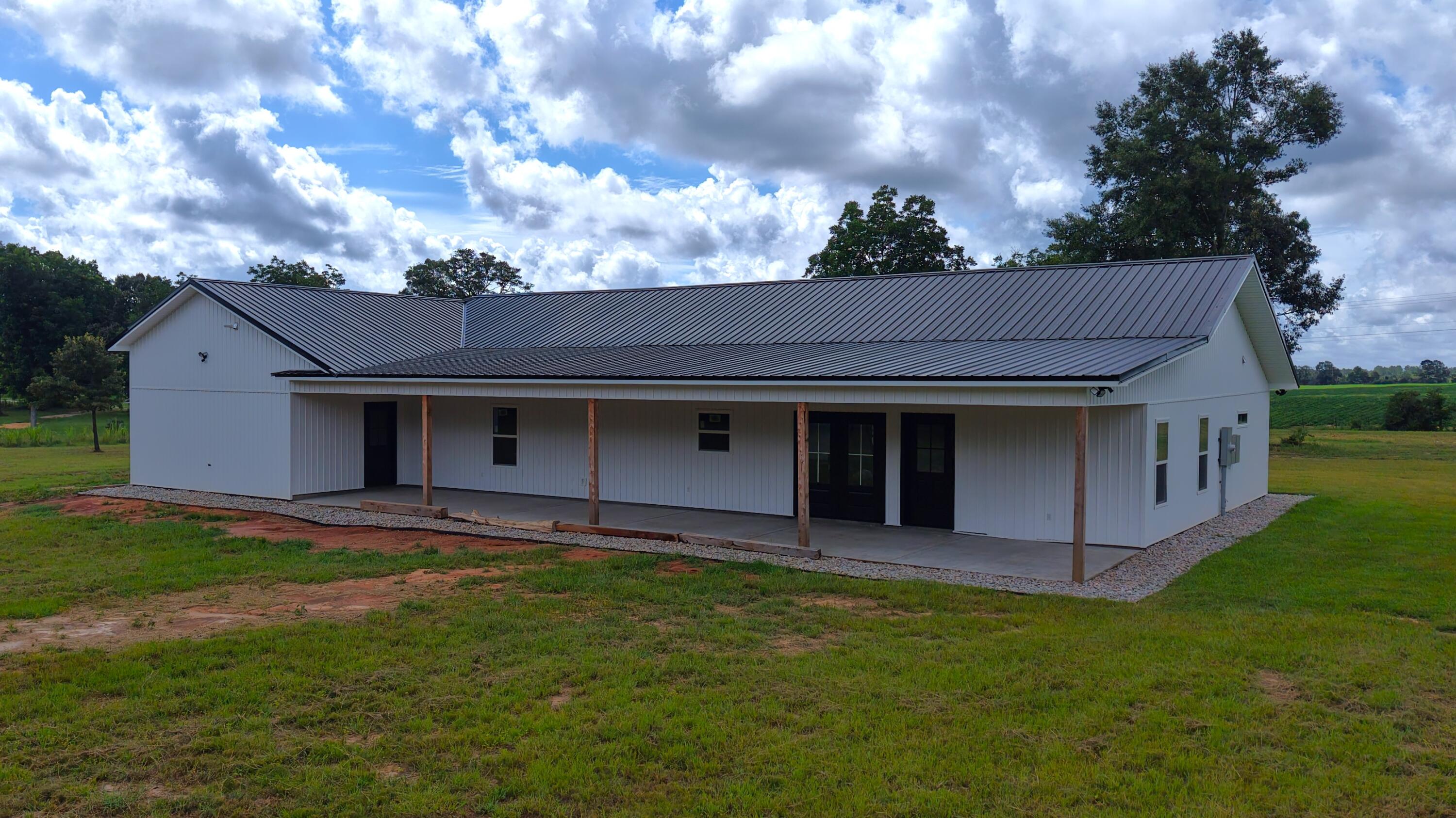 37837 Straughn School Road Out Of State, OUT OF STATE 00000 - Photo 43 of 59 a view of a house with a yard and wooden fence