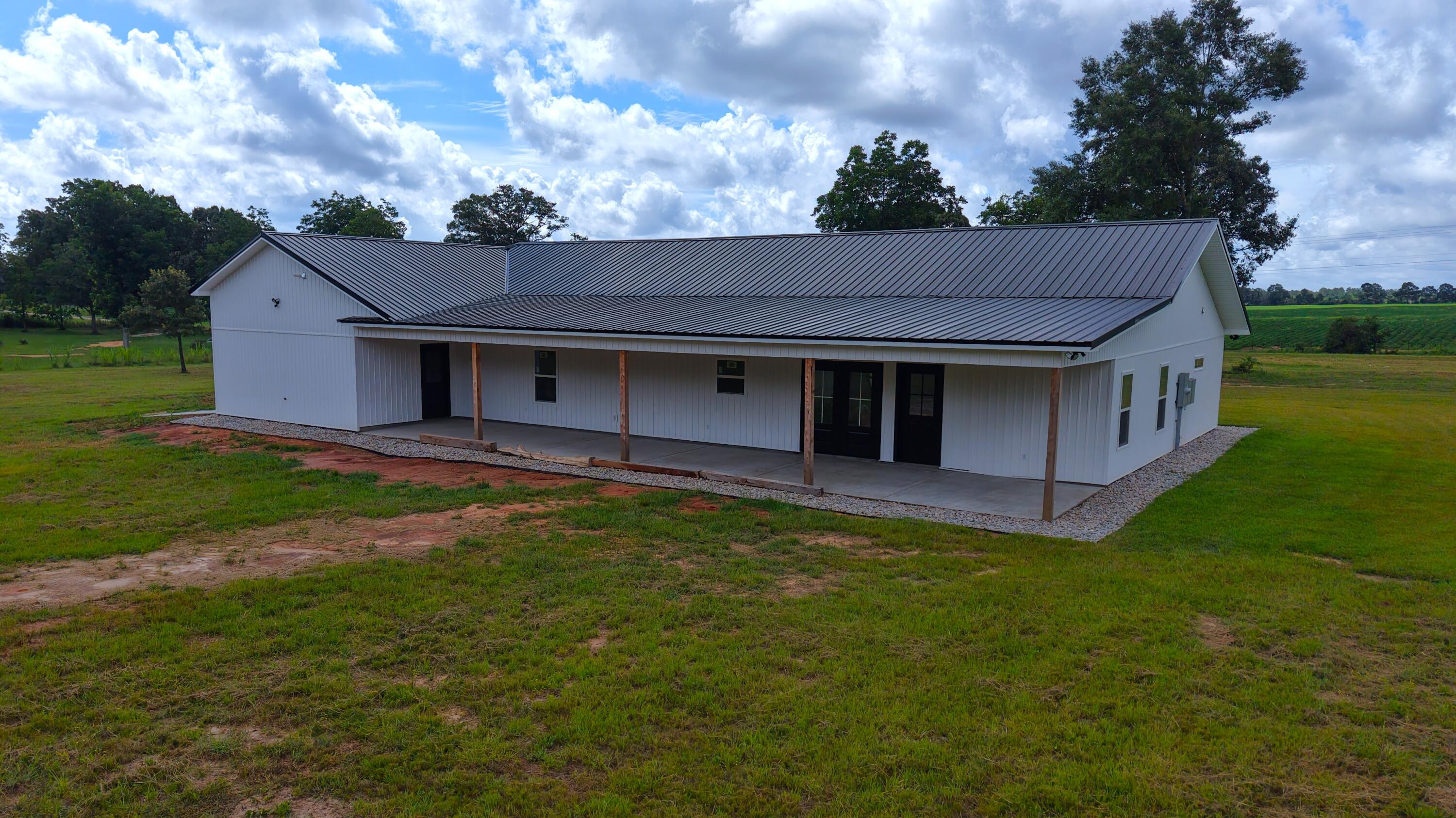 37837 Straughn School Road Out Of State, OUT OF STATE 00000 - Photo 44 of 59 a view of a house with a big yard plants and large tree