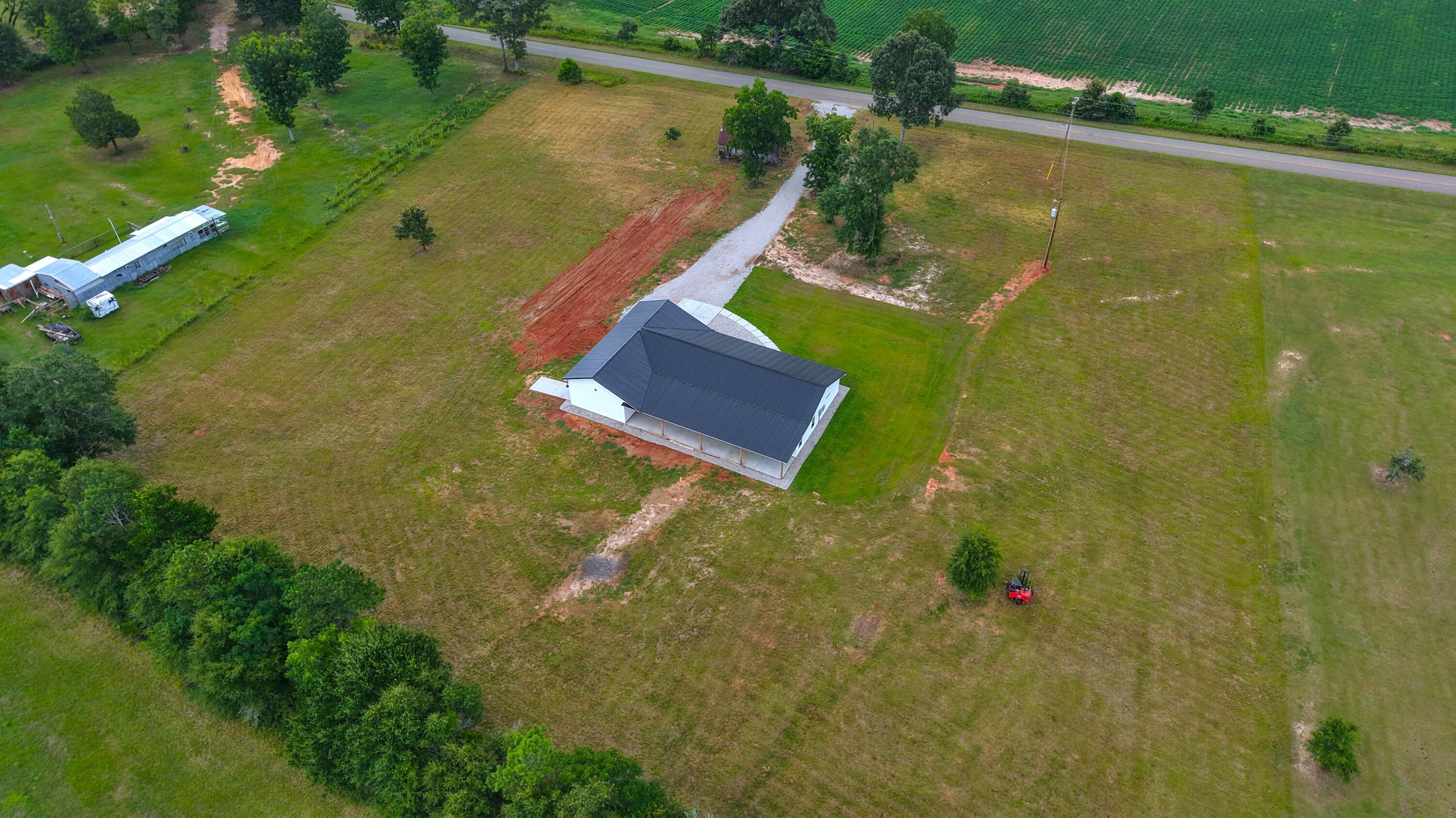 37837 Straughn School Road Out Of State, OUT OF STATE 00000 - Photo 49 of 59 an aerial view of a residential houses with outdoor space and trees all around