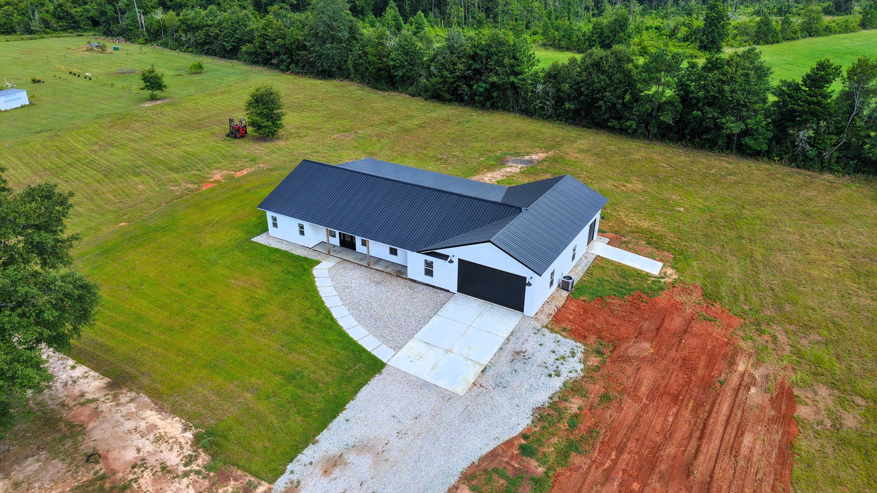 37837 Straughn School Road Out Of State, OUT OF STATE 00000 - Photo 53 of 59 an aerial view of a house with a yard basket ball court and outdoor seating