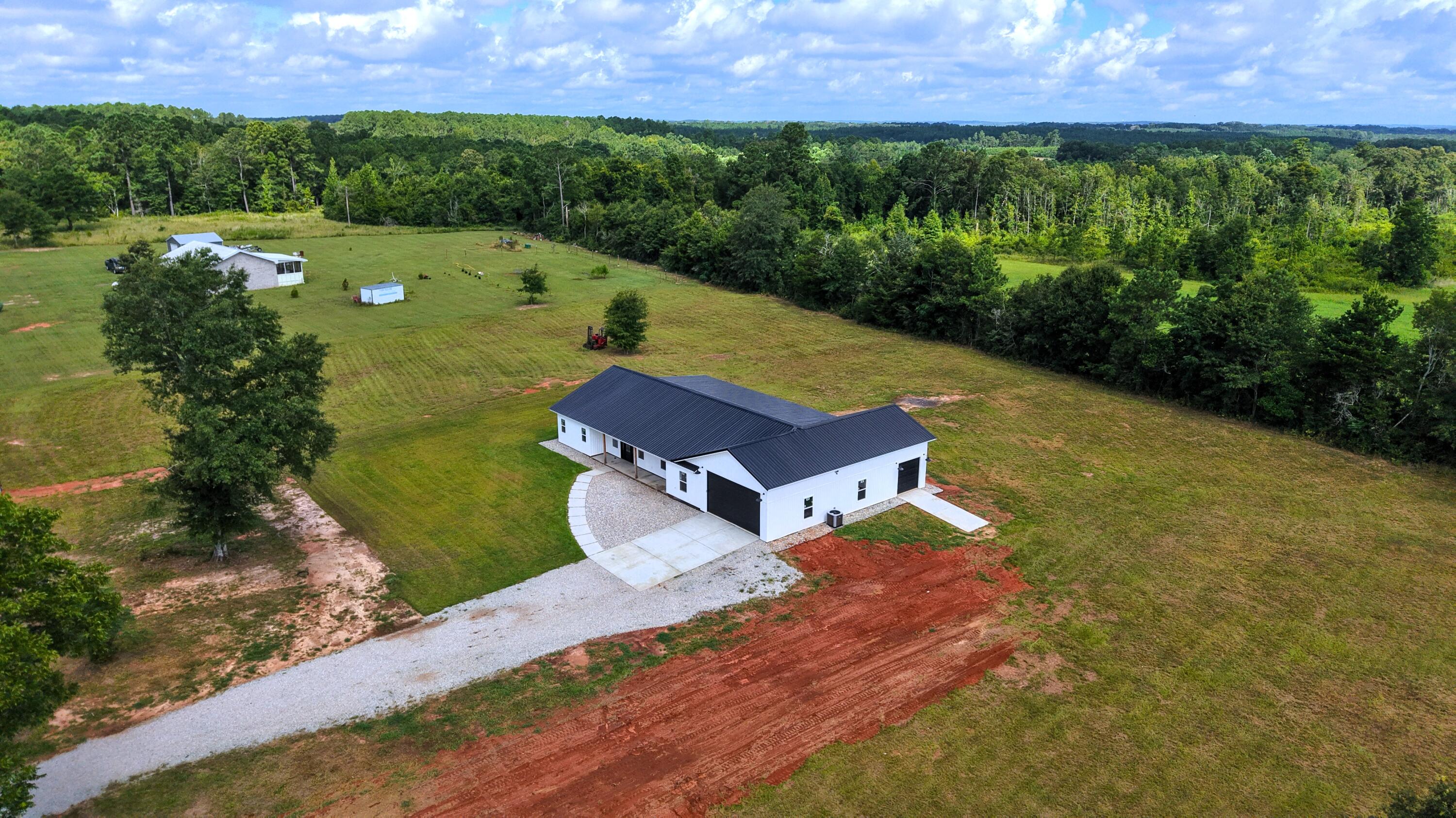 37837 Straughn School Road Out Of State, OUT OF STATE 00000 - Photo 55 of 59 a view of a garden with a house
