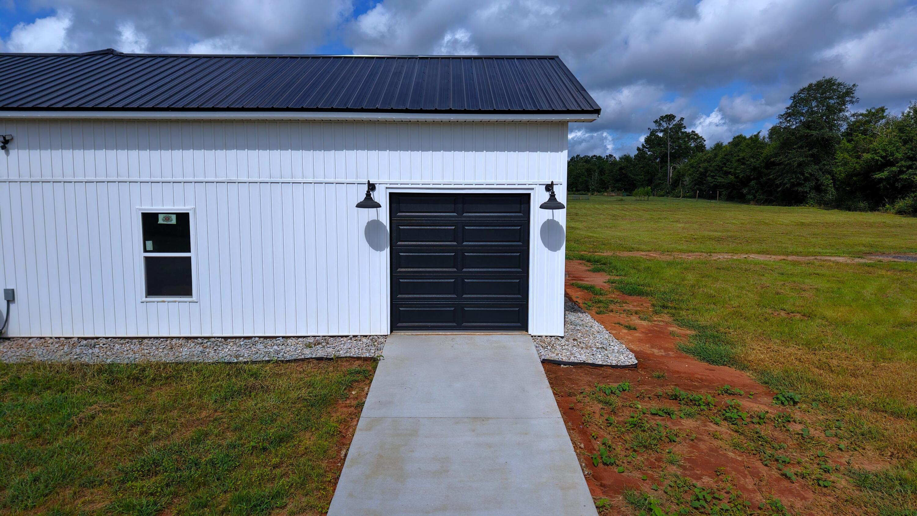 37837 Straughn School Road Out Of State, OUT OF STATE 00000 - Photo 57 of 59 a front view of a house with a yard