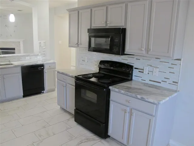 a view of a kitchen with a sink cabinets and a window