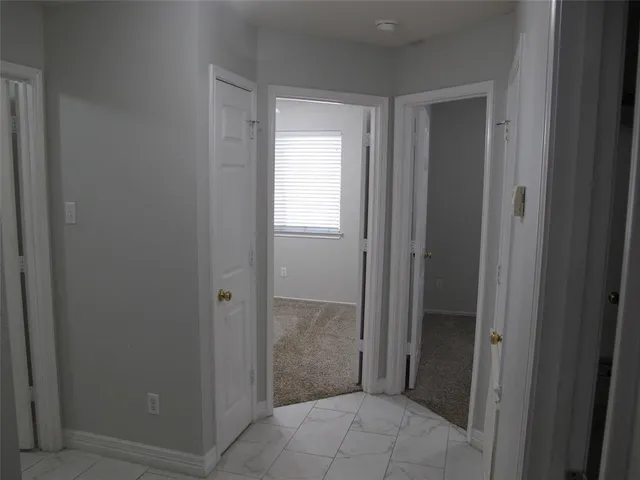a view of wall with wooden fence