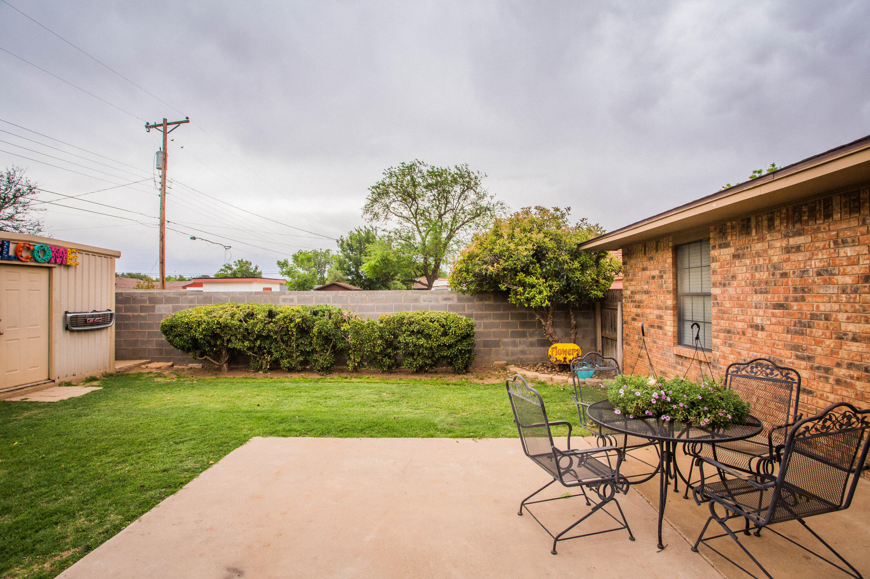 1304 Jefferson Drive Plainview, TX 79072 - Photo 47 of 50 a view of a chair and table in backyard of the house