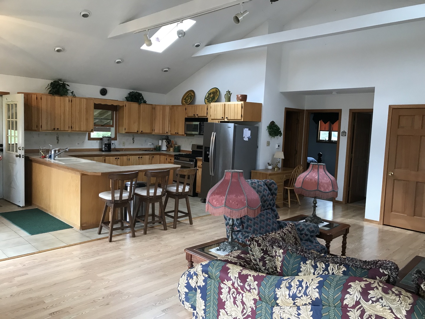 117 County Road 320 North Loda, IL 60948 - Photo 6 of 27 a kitchen with stainless steel appliances kitchen island granite countertop a sink dishwasher a dining table and chairs with wooden floor