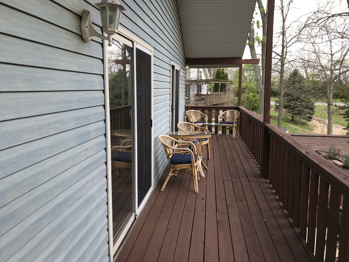 117 County Road 320 North Loda, IL 60948 - Photo 7 of 27 a view of a balcony with chairs and wooden floor