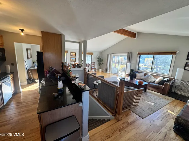 a living room with furniture window and wooden floor
