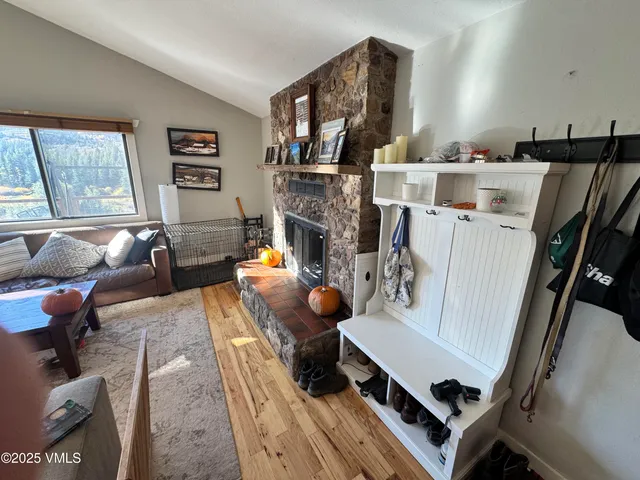 a living room with furniture and a fireplace