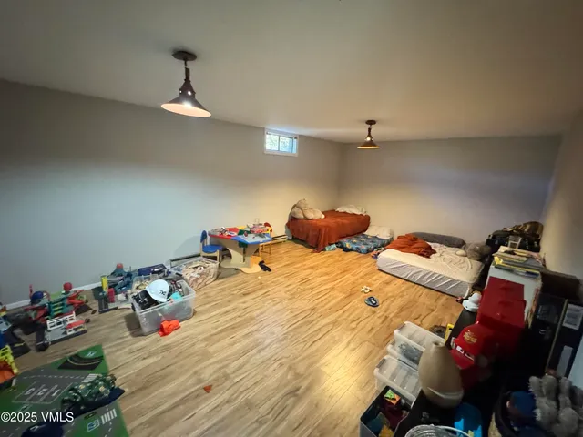 a bed room with a bed and a chandelier