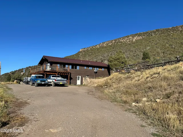 a view of a house with a road