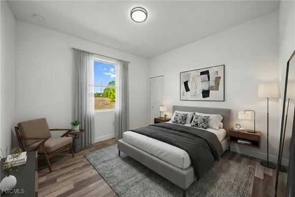 a bedroom with a bed and a chair