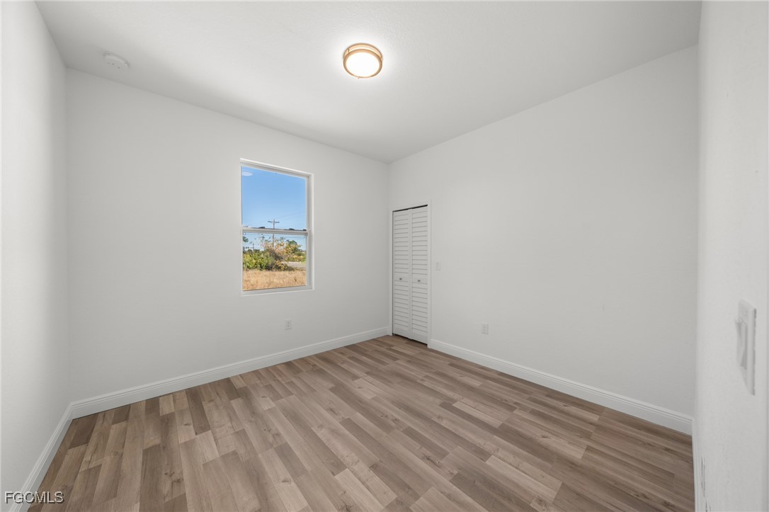 4309 8th Street Southwest Lehigh Acres, FL 33976 - Photo 12 of 25 an empty room with a window