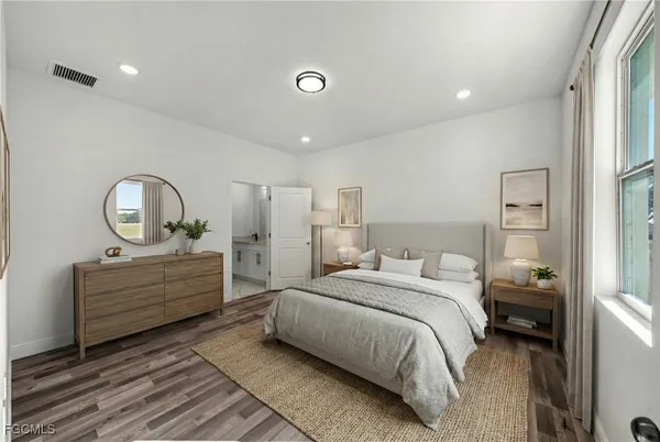 a room with a bed and a dresser