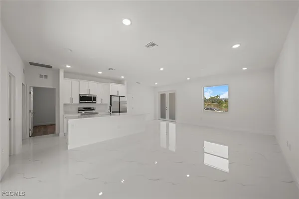 a view of kitchen with stainless steel appliances refrigerator oven