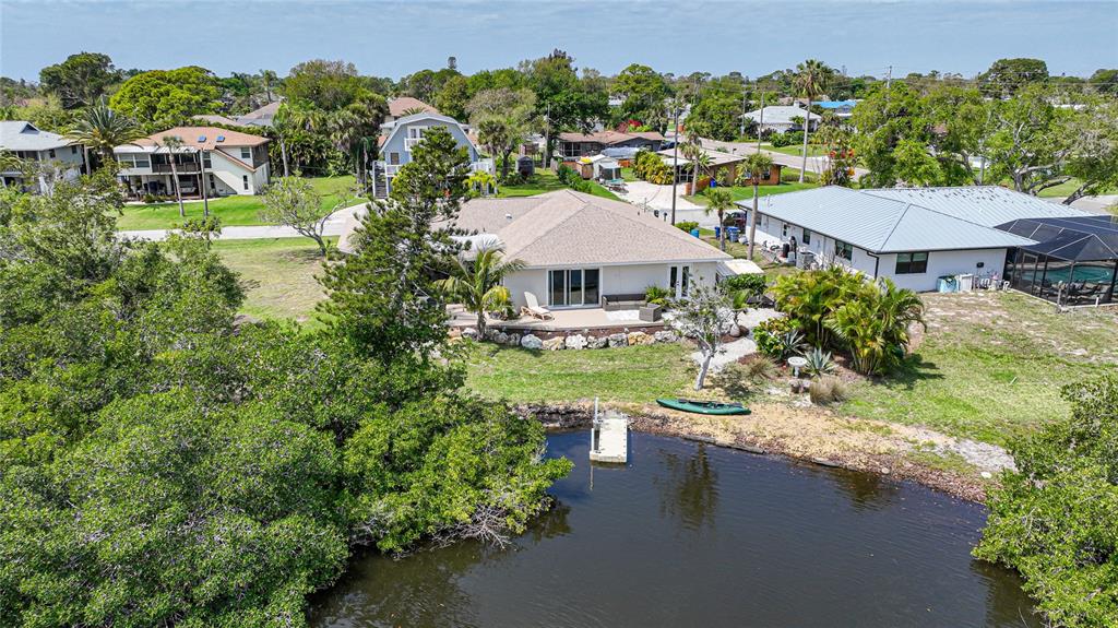 1161 Linden Road Venice, FL 34293 - Photo 1 of 1 a aerial view of a house with a garden and lake view