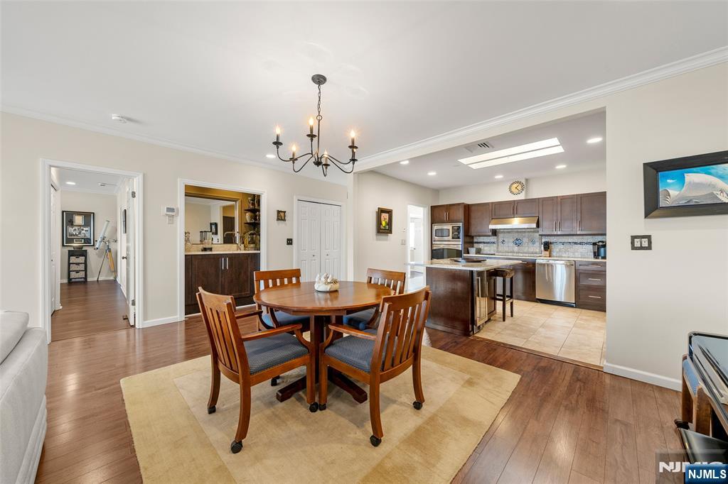 300 Gorge Road, Unit 57 Cliffside Park, NJ 07010 - Photo 13 of 30 a view of a dining room with furniture and wooden floor