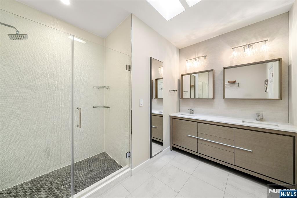 300 Gorge Road, Unit 57 Cliffside Park, NJ 07010 - Photo 19 of 30 a bathroom with a sink and a mirror