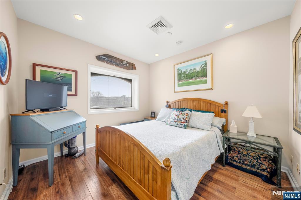 300 Gorge Road, Unit 57 Cliffside Park, NJ 07010 - Photo 20 of 30 a bedroom with a bed and a table in it