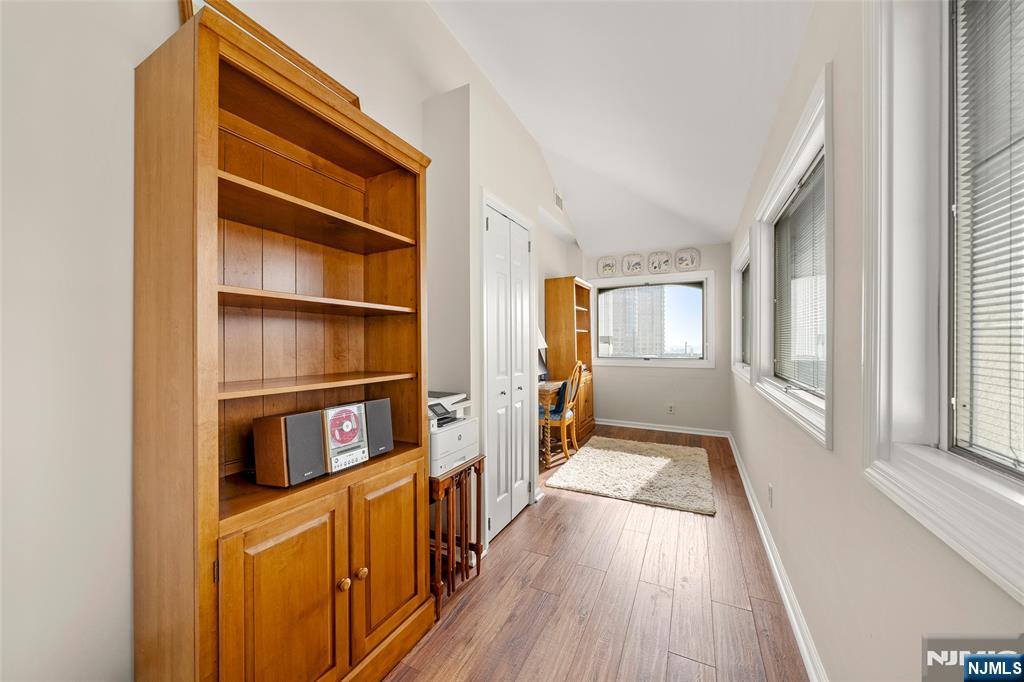300 Gorge Road, Unit 57 Cliffside Park, NJ 07010 - Photo 22 of 30 a view of a hallway with wooden floor and staircase