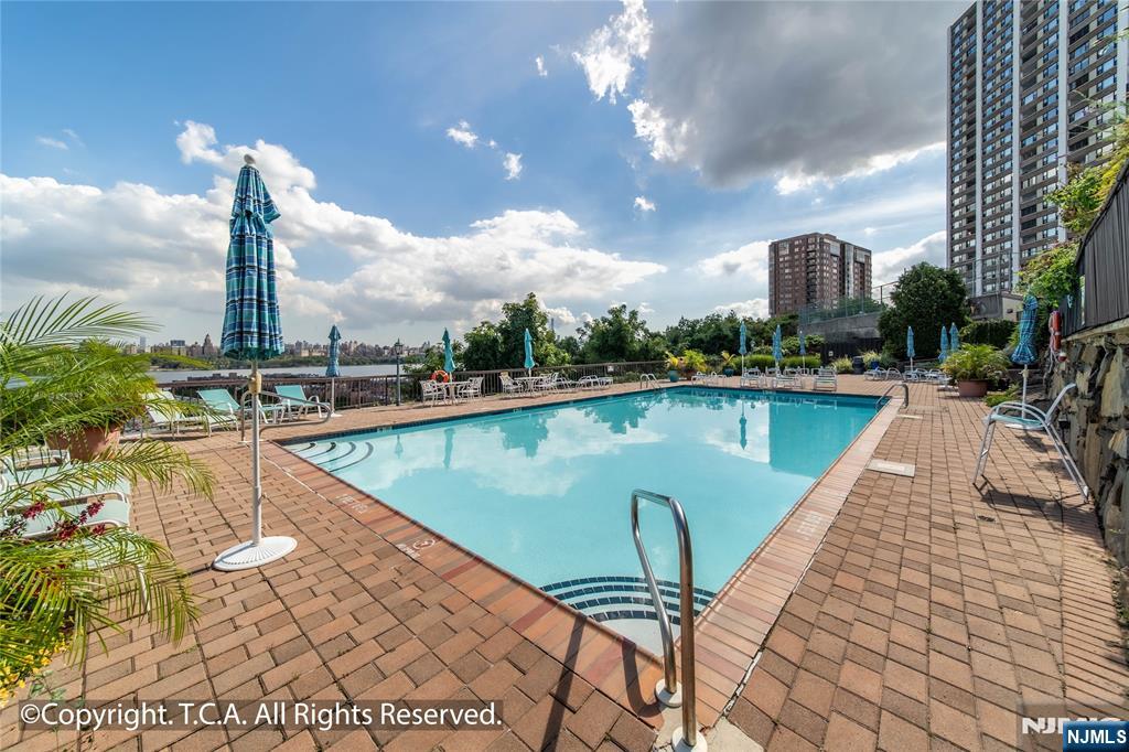 300 Gorge Road, Unit 57 Cliffside Park, NJ 07010 - Photo 29 of 30 a view of a swimming pool with a terrace